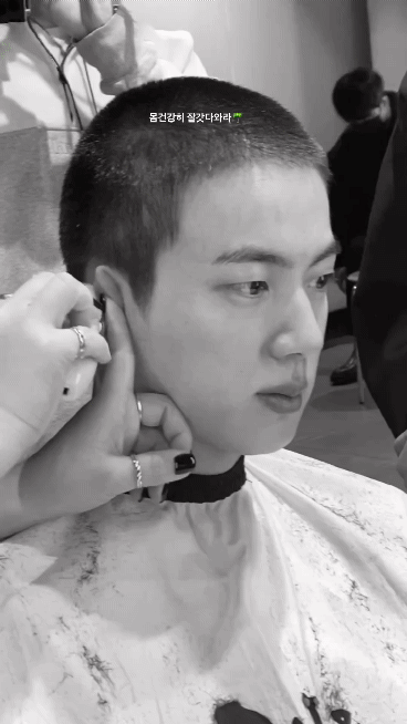 The video of BTS Jin cutting his hair looks like a scene from a movie