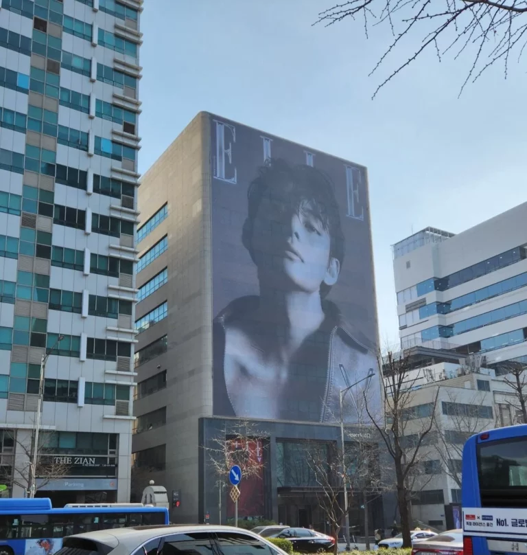 BTS V for Elle Korea covers displayed on LED Billboards in the building where the Elle Korea office is located