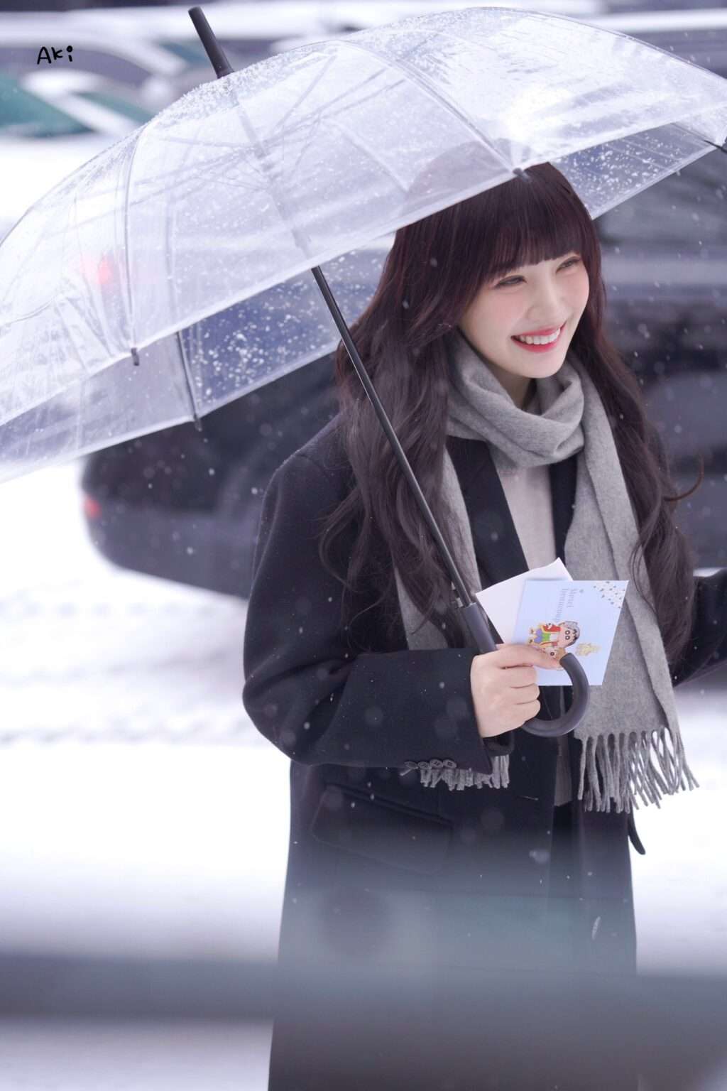 Red Velvet Joy on her way to work on a snowy day with long bangs and ...