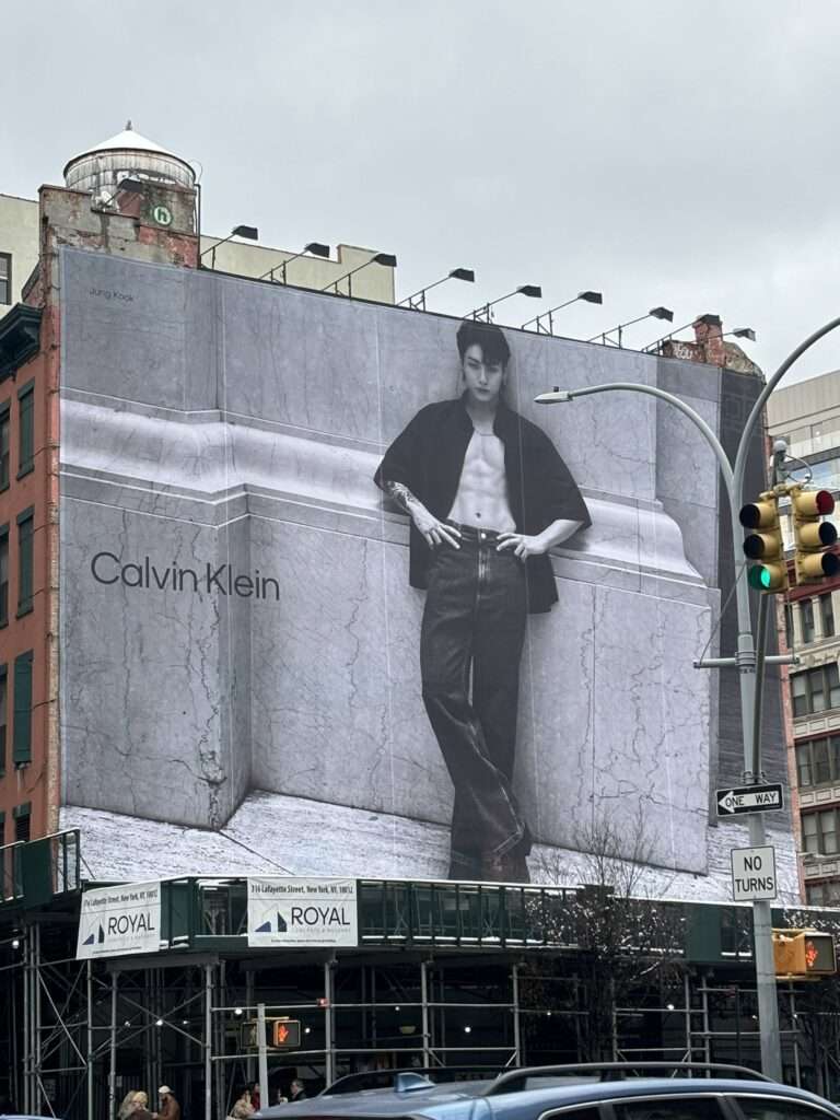 The large electronic billboard of Jungkook × Calvin Klein's new campaign on the street in New York