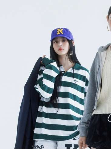 Did Min Heejin promote NewJeans' comeback with her clothes during the press conference?
