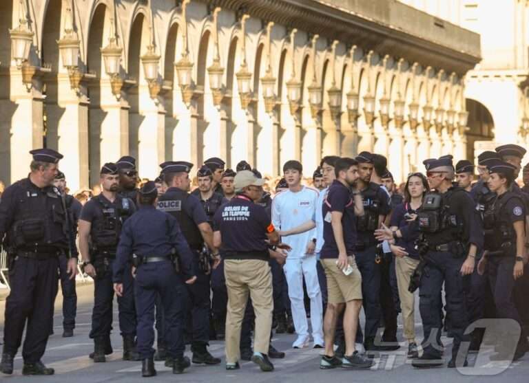 BTS Jin was surrounded by about 30 French National Police (CRS) today